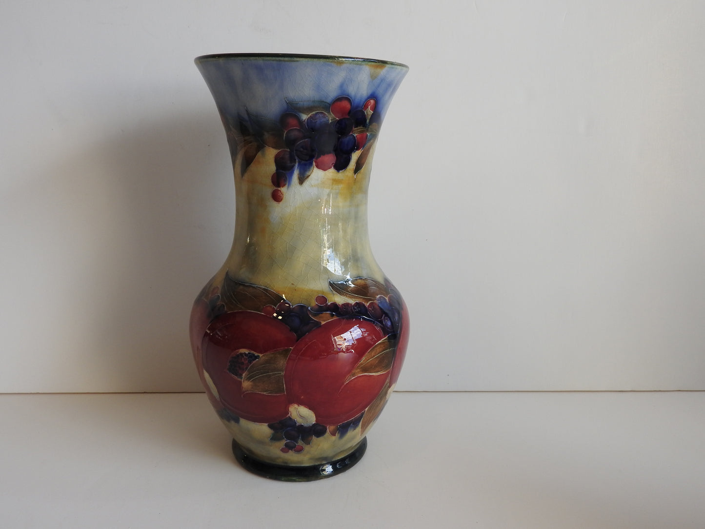 William Moorcroft Pomegranate Vase on a rare background c1913